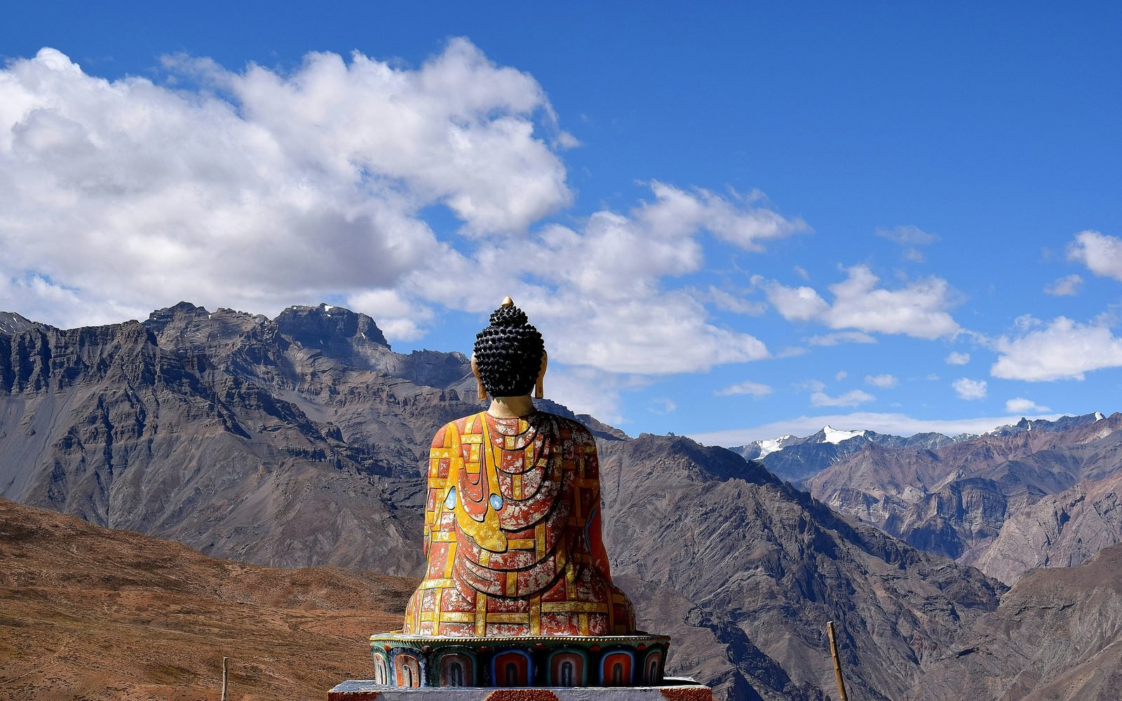 Interior of a Himalayan Buddhist monastery in low, warm light